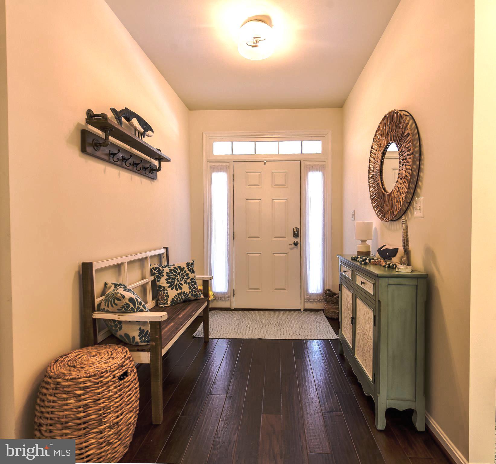 34148 Spring Brook Avenue Lewes, DE 19958 - Photo 4 of 77 a living room with furniture floor to ceiling window