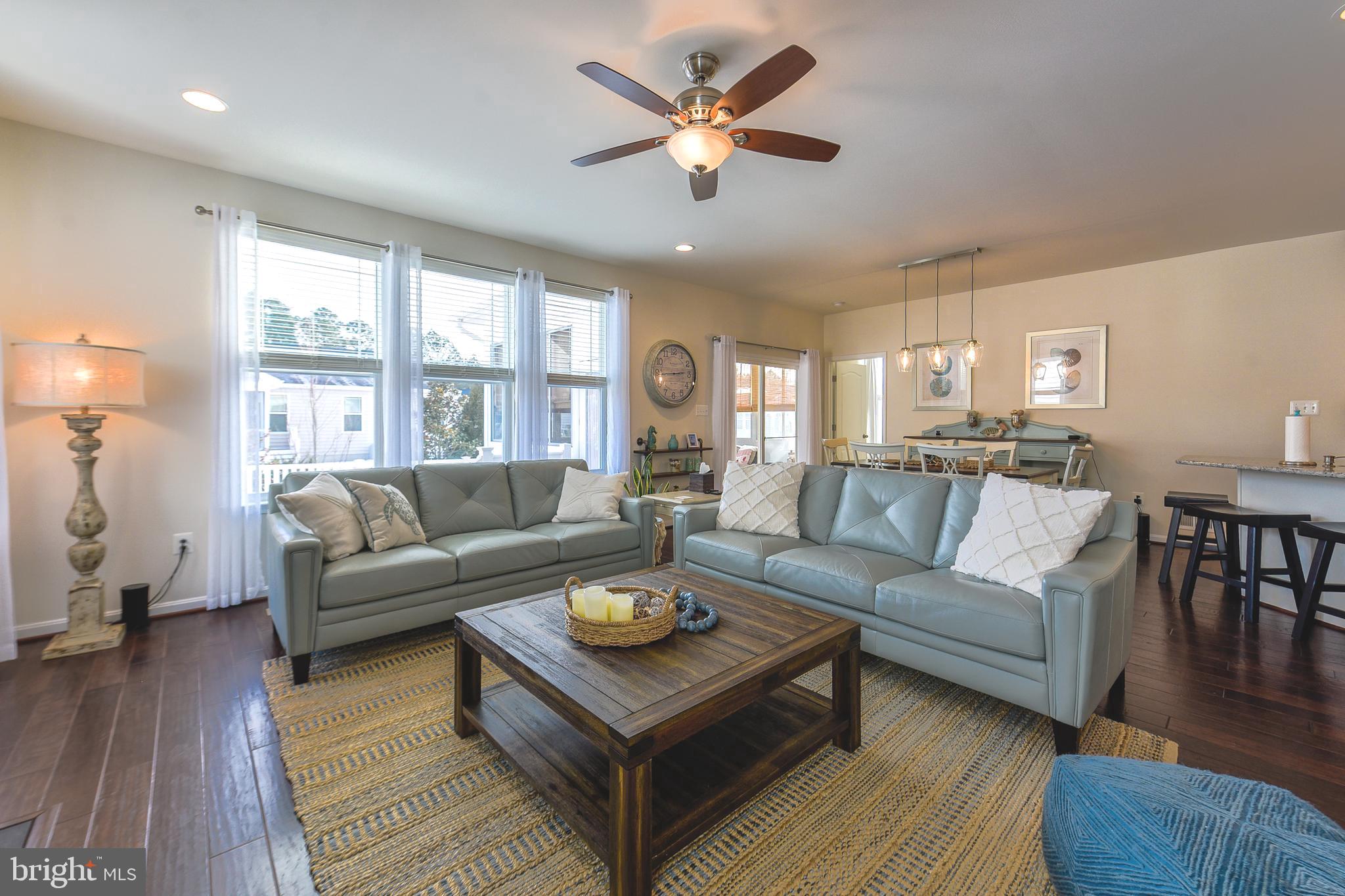 34148 Spring Brook Avenue Lewes, DE 19958 - Photo 10 of 77 a living room with furniture a large window and a rug