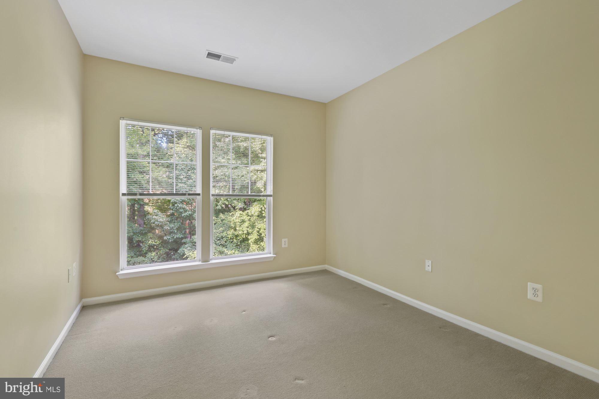 1511 North Point Drive, Unit 302 Reston, VA 20194 - Photo 14 of 25 Bedroom #2, also surrounded by trees