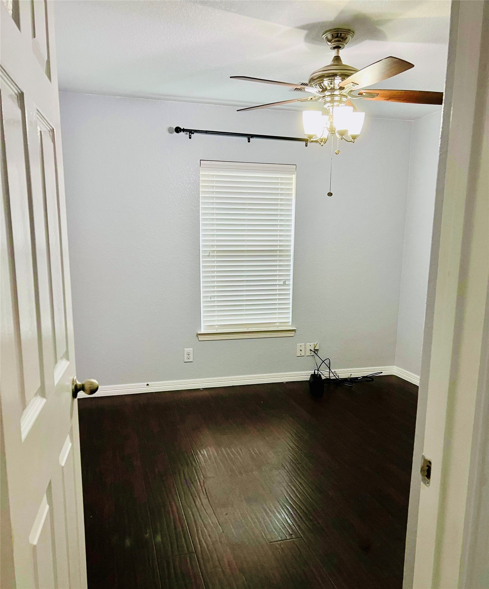 722 Pequin Road Crosby, TX 77532 - Photo 7 of 12 en empty room with wooden floor and window