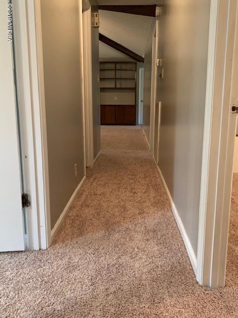 8449 Lower Thomaston Road Lizella, GA 31052 - Photo 8 of 9 a view of a hallway with wooden floor and closet
