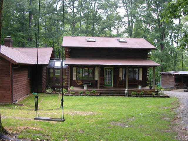 a table and chairs in front of a house