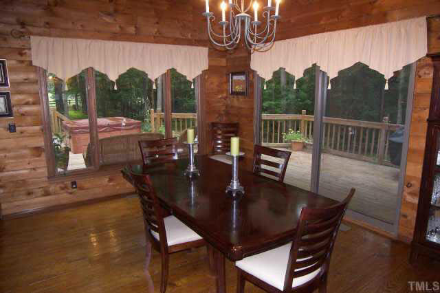8212 Ridgeback Road Apex, NC 27523 - Photo 3 of 10 a view of a dining room with furniture window and outside view