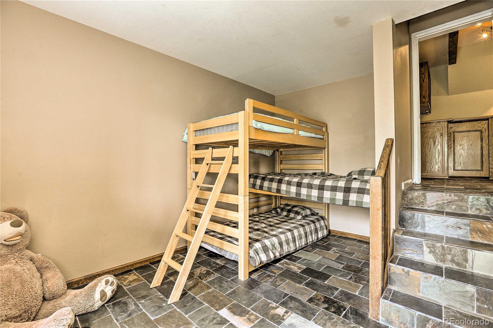 345 Old Sawmill Road Bailey, CO 80421 - Photo 23 of 39 a bedroom with a bed and a window