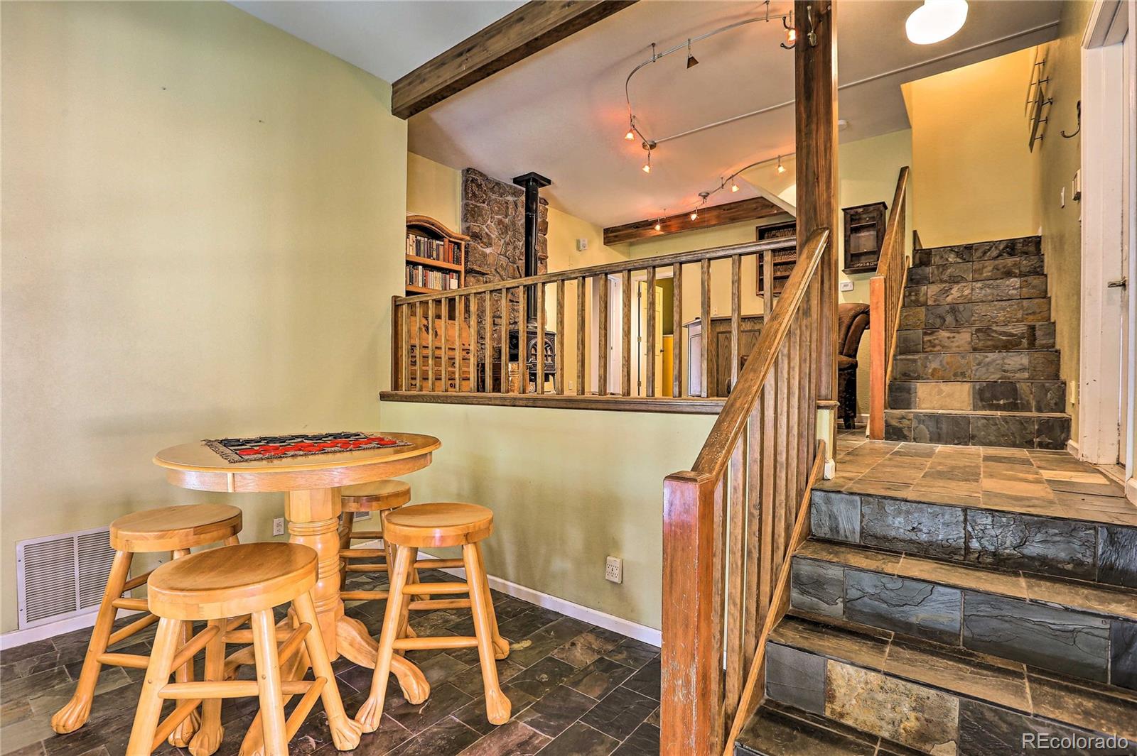 345 Old Sawmill Road Bailey, CO 80421 - Photo 27 of 39 a view of a balcony with furniture and the front door