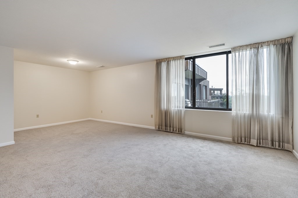 1002 Paradise Road, Unit PHE Swampscott, MA 01907 - Photo 12 of 23 a view of an empty room with a window