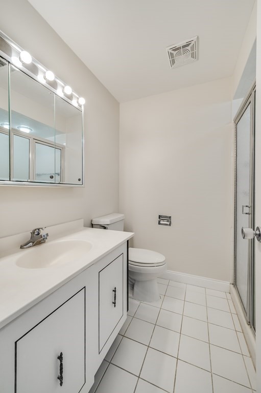 1002 Paradise Road, Unit PHE Swampscott, MA 01907 - Photo 17 of 23 a bathroom with a sink a toilet and mirror