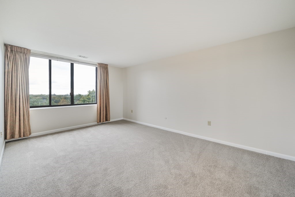 1002 Paradise Road, Unit PHE Swampscott, MA 01907 - Photo 18 of 23 a view of an empty room with a window