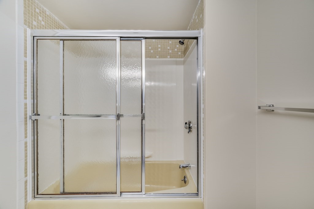 1002 Paradise Road, Unit PHE Swampscott, MA 01907 - Photo 21 of 23 a bathroom with a glass shower door
