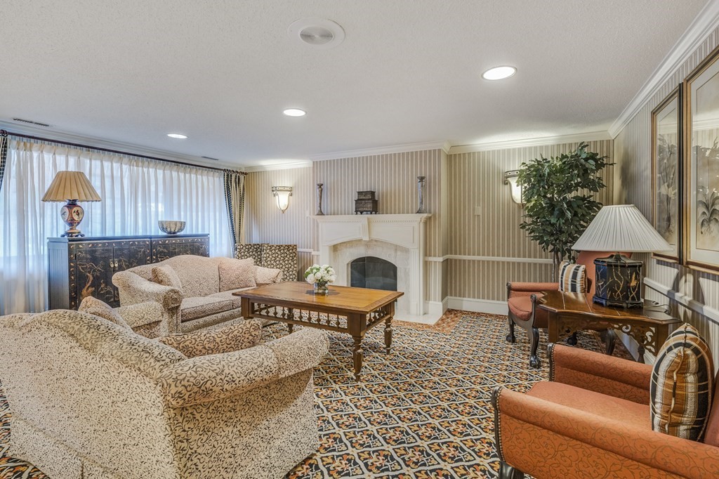 1002 Paradise Road, Unit PHE Swampscott, MA 01907 - Photo 22 of 23 a living room with furniture and a fireplace