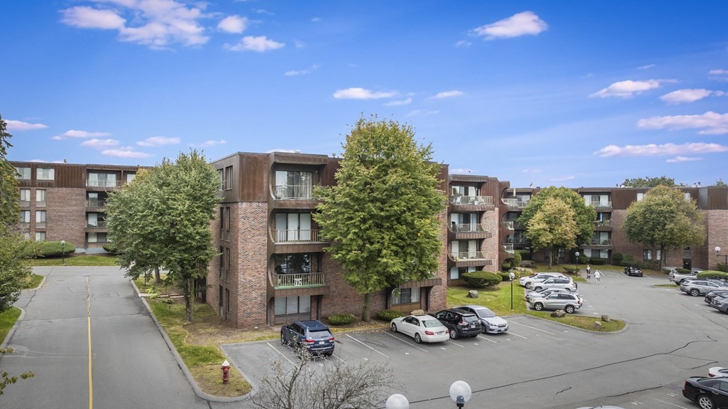 1002 Paradise Road, Unit PHE Swampscott, MA 01907 - Photo 4 of 23 a car parked on the side of a street