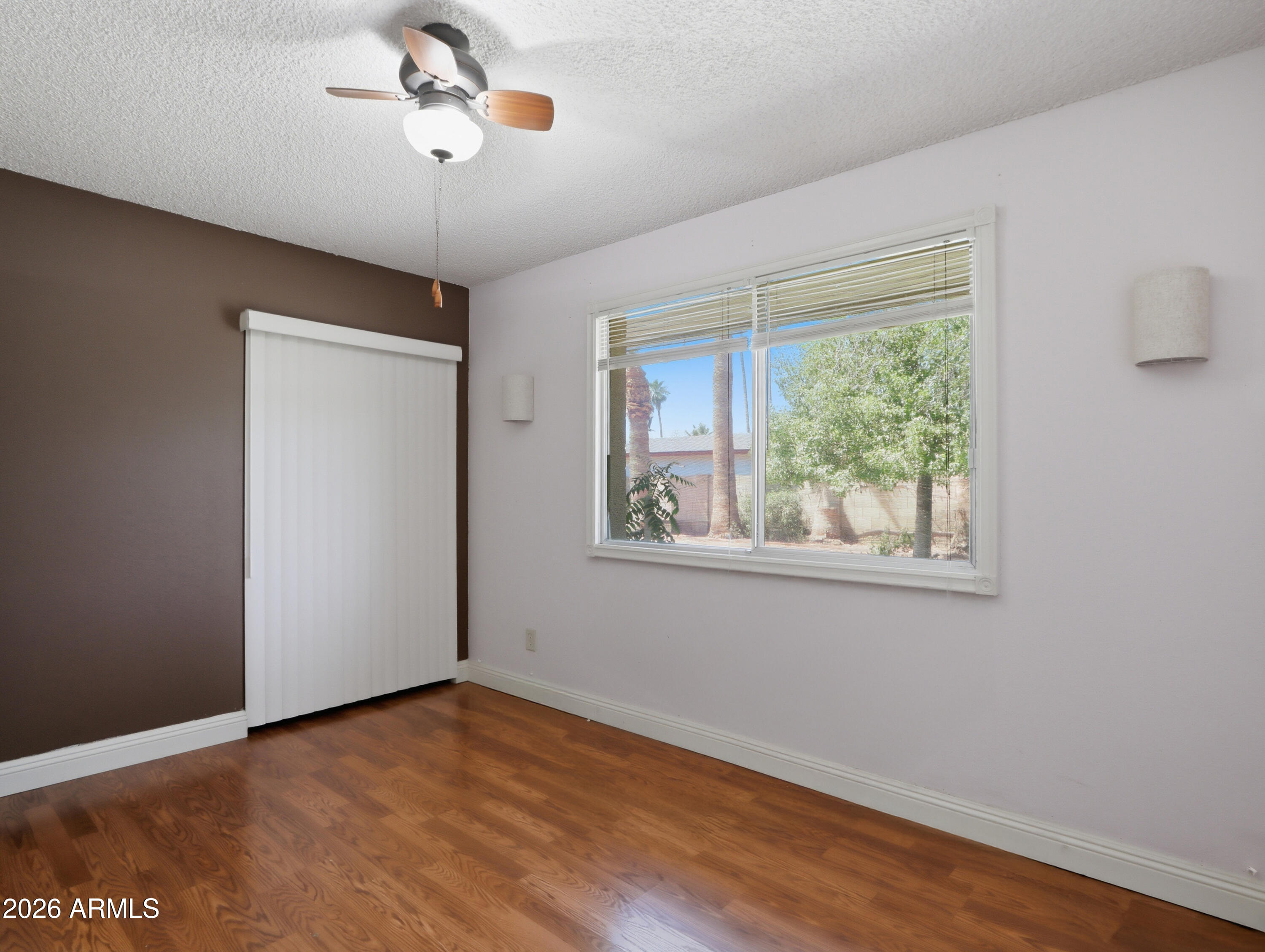 450 Cascada Road Litchfield Park, AZ 85340 - Photo 25 of 40 a view of an empty room with a window