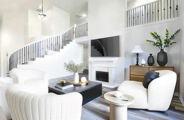 a living room with furniture a fireplace and a flat screen tv