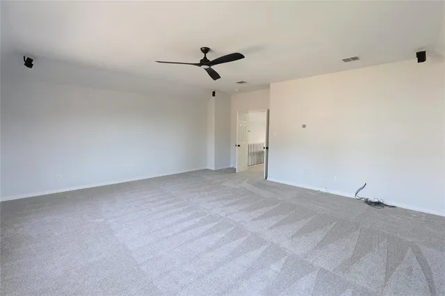 a view of a big room with carpet