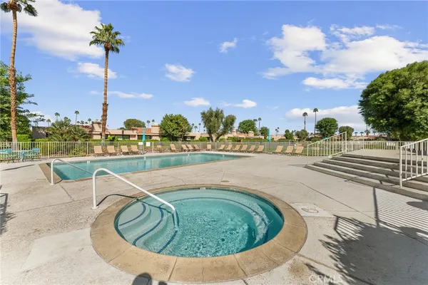 a view of a swimming pool with a terrace