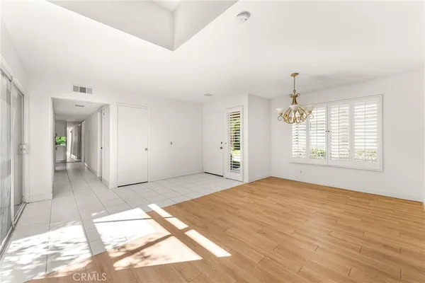 a view of empty room with floor to ceiling window
