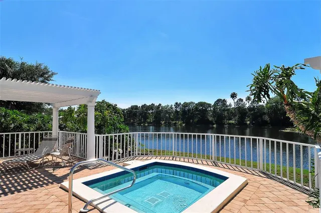 an aerial view of a house with a lake view