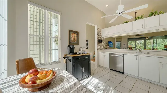 a kitchen with sink cabinets and outdoor view
