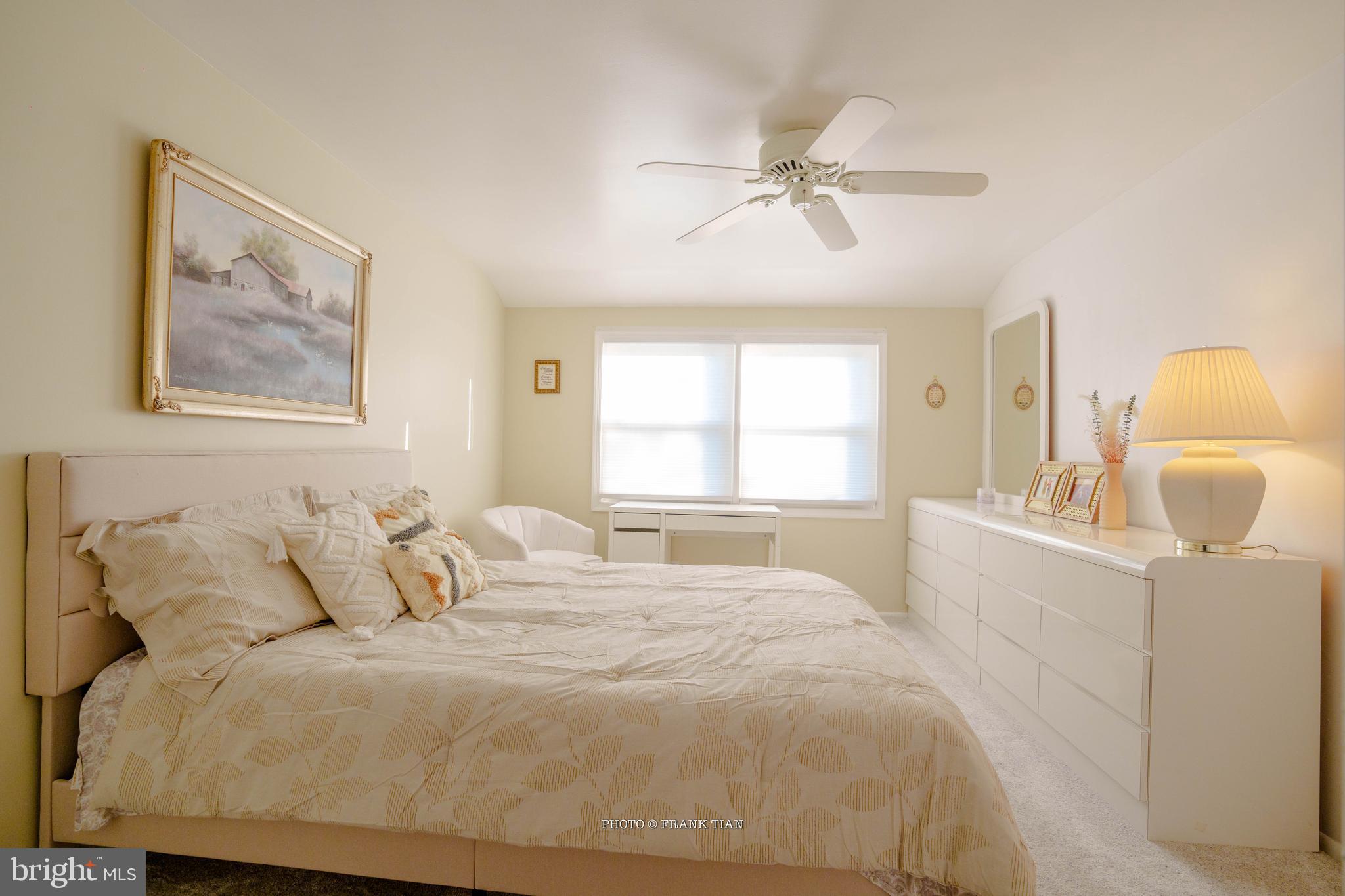 8 Ramsgate Road Cherry Hill, NJ 08003 - Photo 20 of 42 a bedroom with a bed and a chandelier