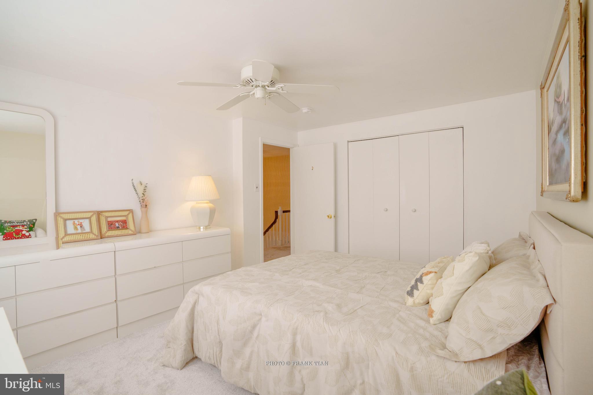 8 Ramsgate Road Cherry Hill, NJ 08003 - Photo 24 of 42 a bedroom with a white bed and a chandelier