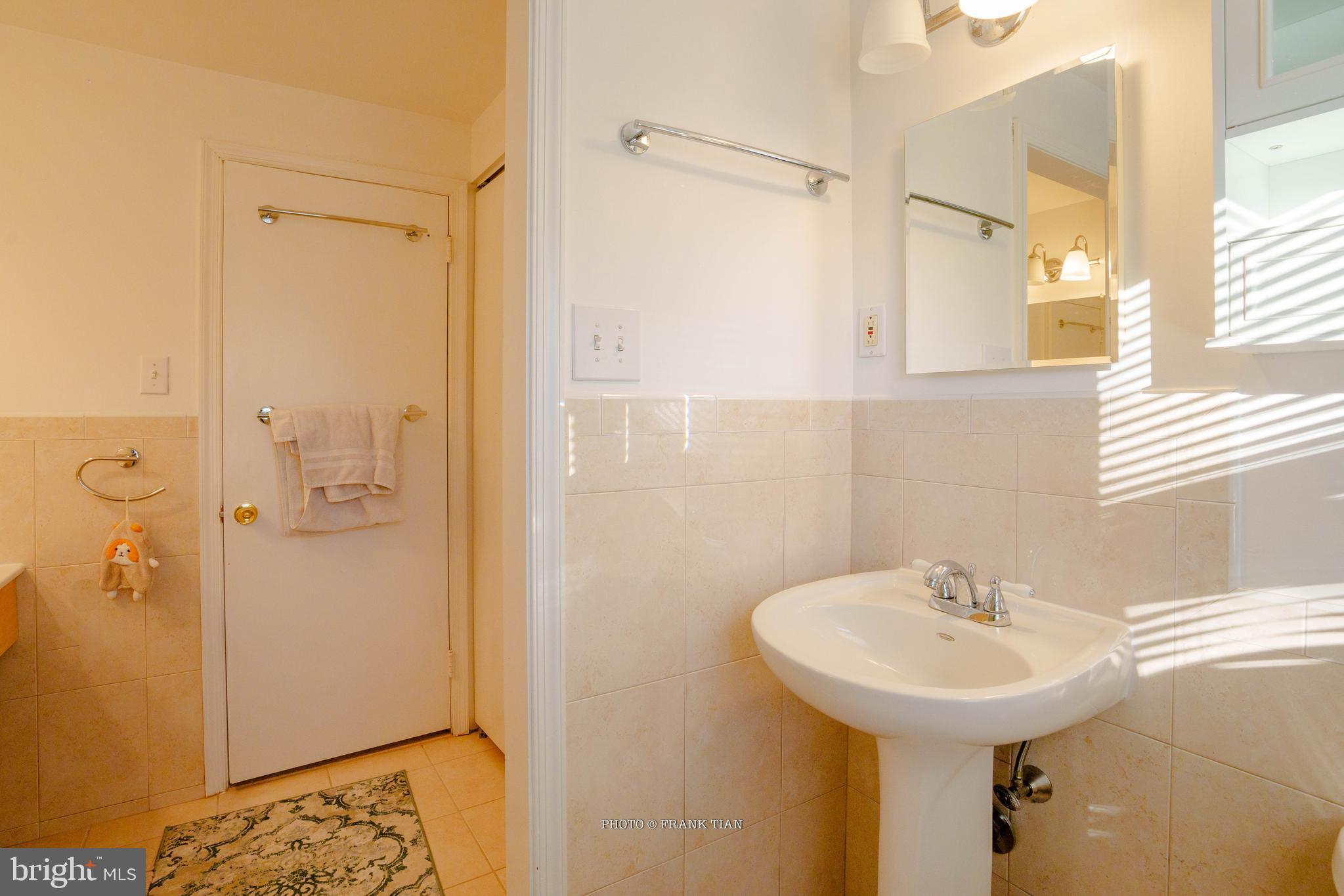 8 Ramsgate Road Cherry Hill, NJ 08003 - Photo 27 of 42 a bathroom with a sink a mirror and shower