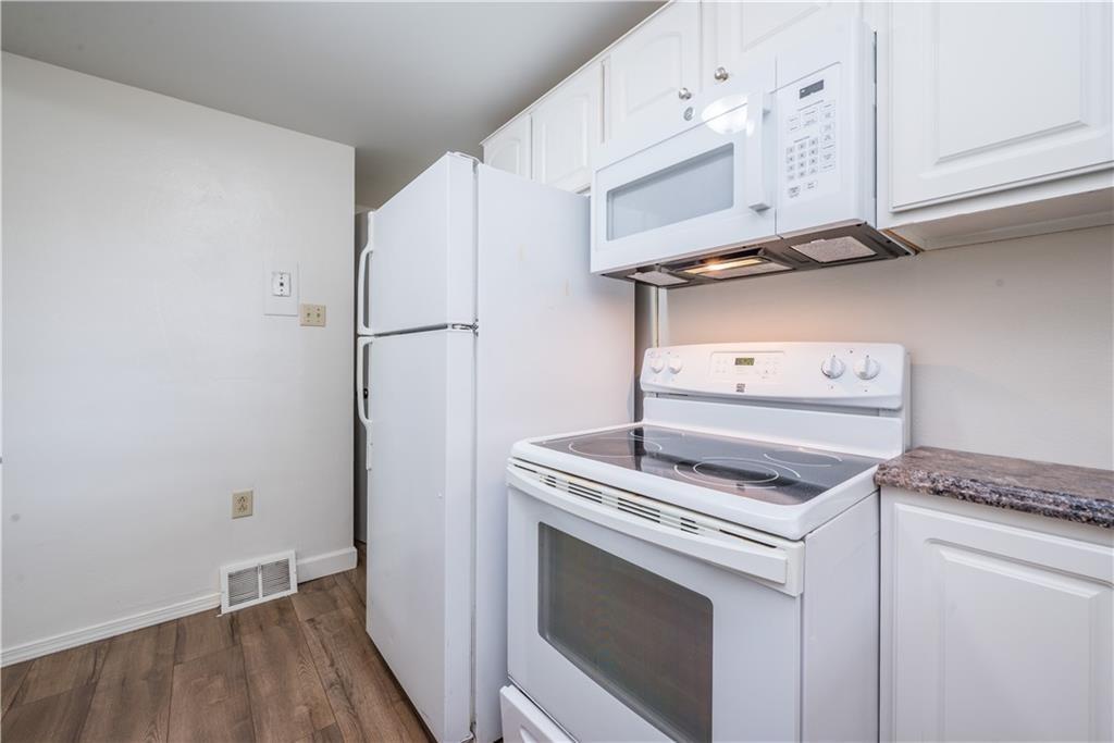 334 Moon Clinton Road, Unit B Coraopolis, PA 15108 - Photo 16 of 46 a kitchen with a stove and a white cabinet
