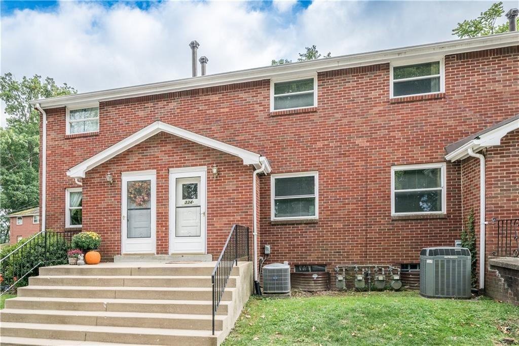 334 Moon Clinton Road, Unit B Coraopolis, PA 15108 - Photo 2 of 46 a front view of a house with a yard
