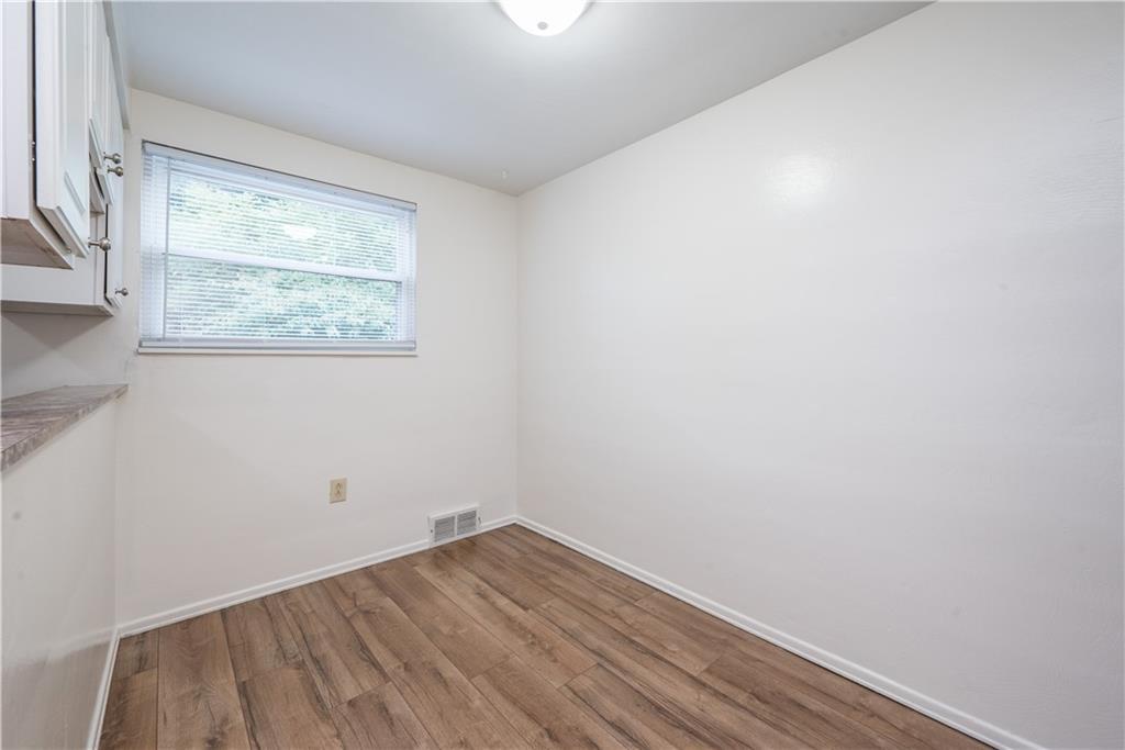 334 Moon Clinton Road, Unit B Coraopolis, PA 15108 - Photo 23 of 46 a view of a room that has wooden floor and large window