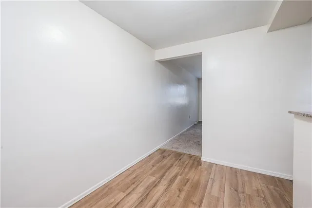 a view of small space with wooden floor