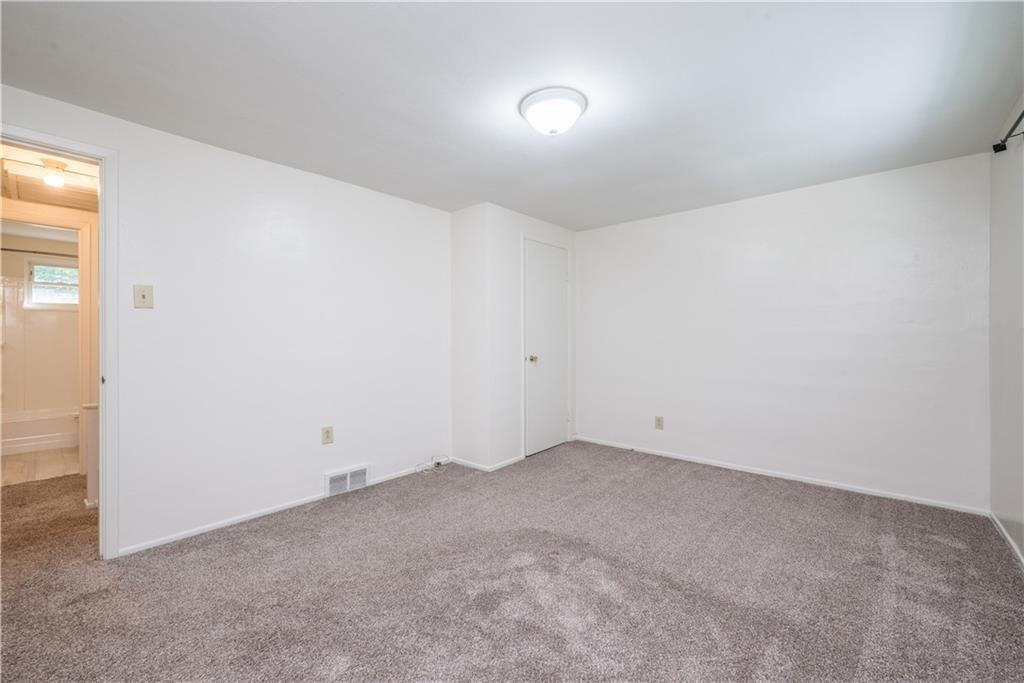 334 Moon Clinton Road, Unit B Coraopolis, PA 15108 - Photo 27 of 46 an empty room with a empty space and windows