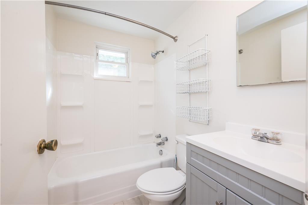 334 Moon Clinton Road, Unit B Coraopolis, PA 15108 - Photo 31 of 46 a bathroom with a sink a toilet and a bathtub