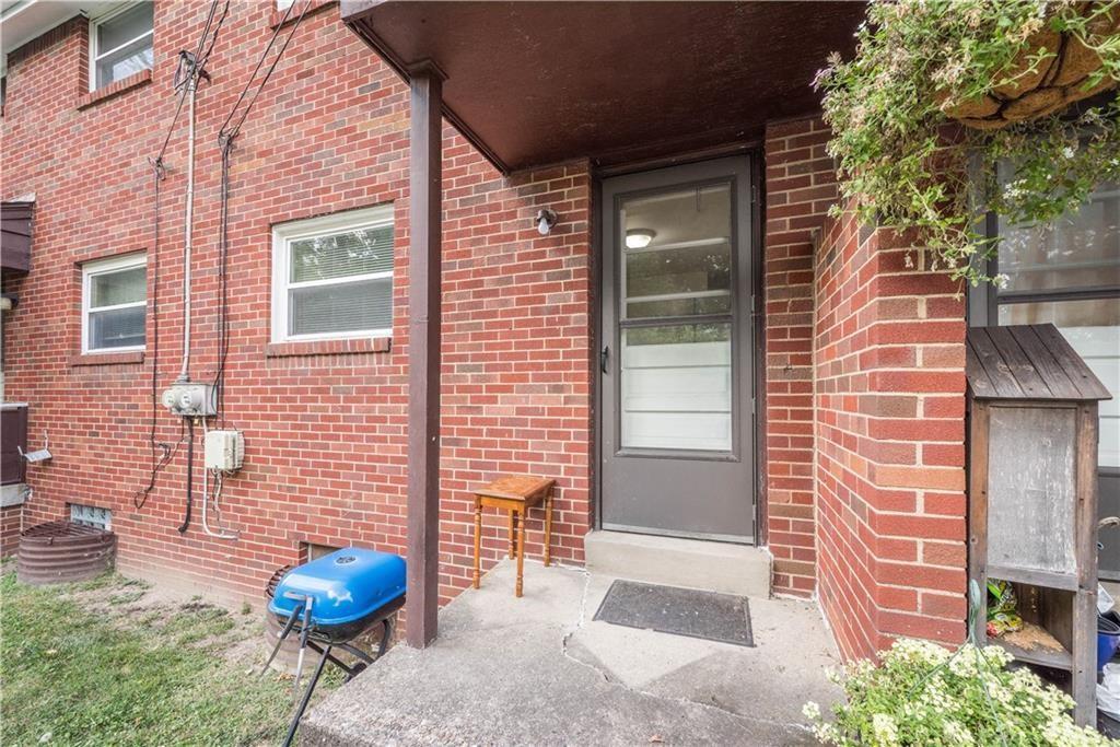 334 Moon Clinton Road, Unit B Coraopolis, PA 15108 - Photo 42 of 46 a view of a backyard with a table and chairs and potted plants
