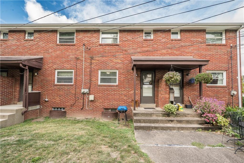 334 Moon Clinton Road, Unit B Coraopolis, PA 15108 - Photo 43 of 46 a front view of a house with garden