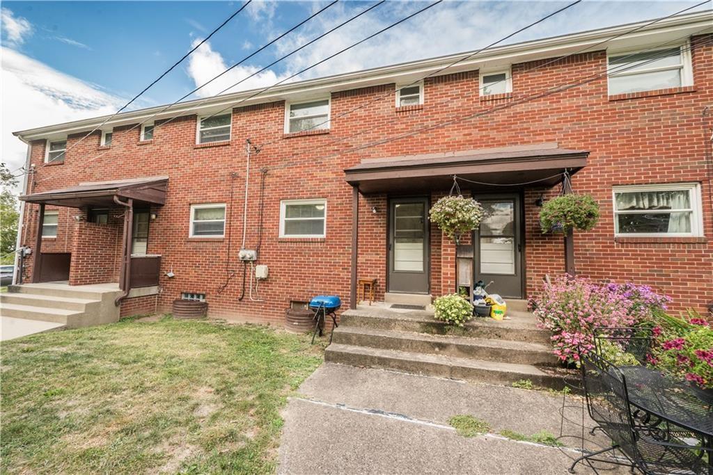 334 Moon Clinton Road, Unit B Coraopolis, PA 15108 - Photo 44 of 46 front view of a brick house with a yard