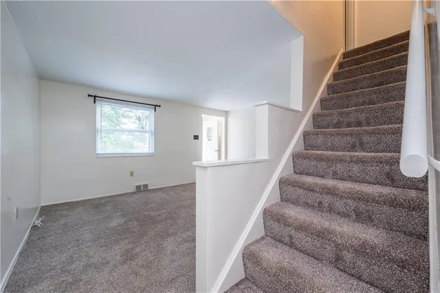 a view of an entryway with stairs