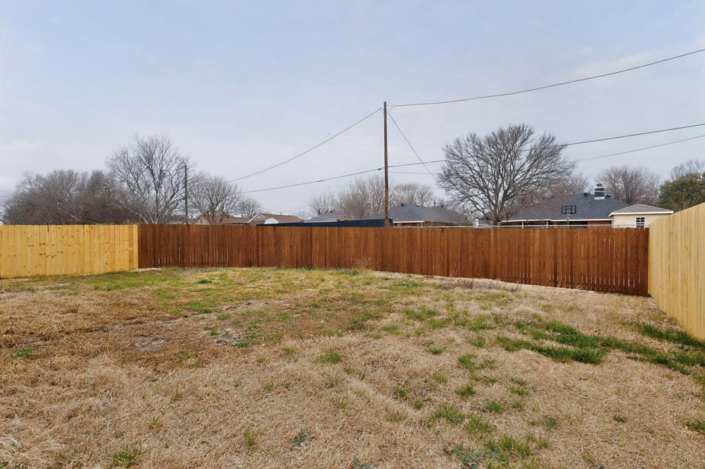 10166 Budtime Lane Dallas, TX 75217 - Photo 31 of 34 a view of a backyard