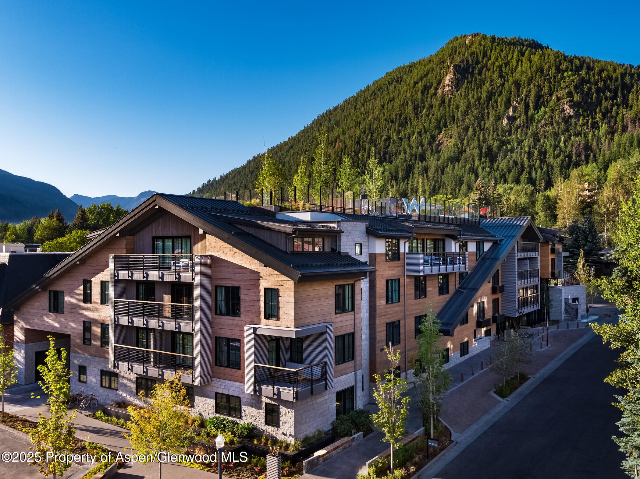 550 South Spring Street, Unit F21 Aspen, CO 81611 - Photo 10 of 12 a front view of a house with a yard
