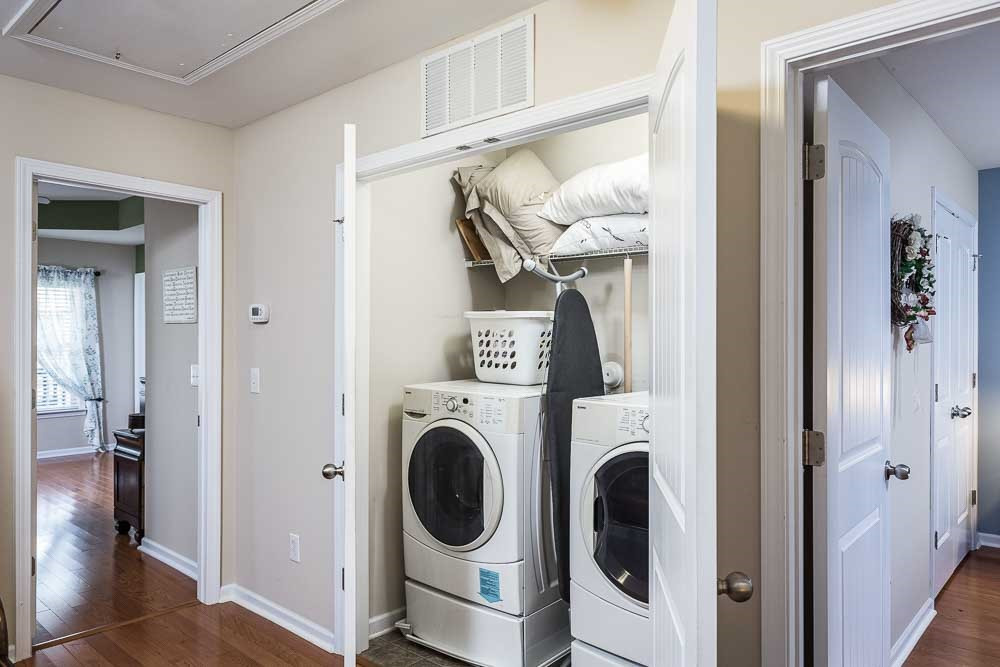 1310 Still Monument Way Raleigh, NC 27603 - Photo 17 of 27 Conveniently located between the bedrooms in the spacious landing - note the hardwoods throughout the upstairs! Laundry