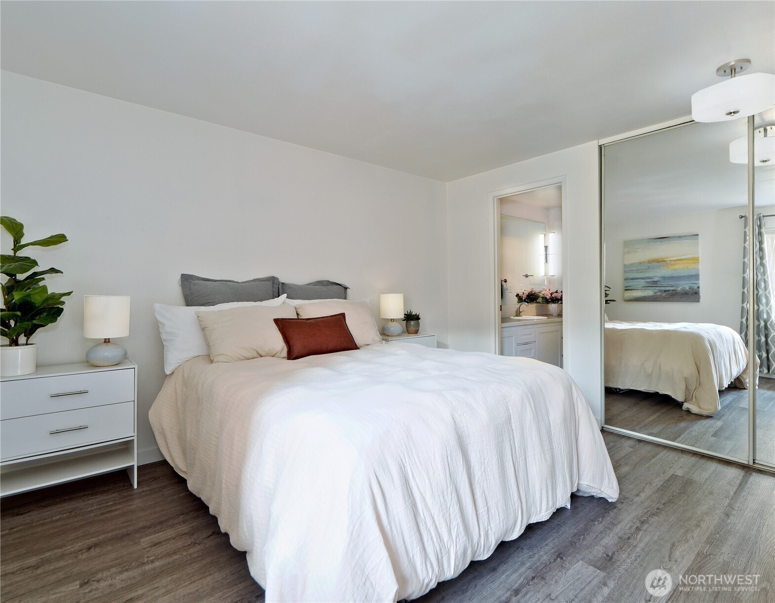 3700 25th Place West, Unit 202 Seattle, WA 98199 - Photo 13 of 21 a bedroom with bed and a closet