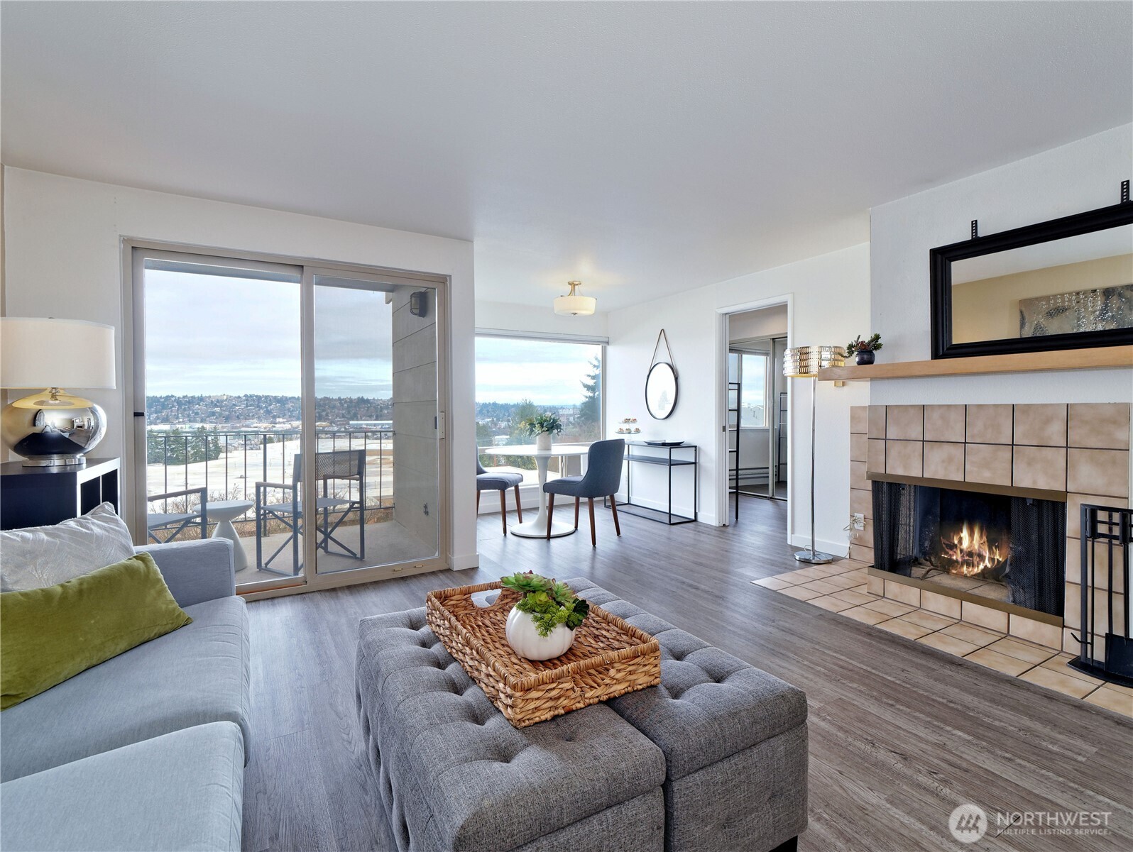 3700 25th Place West, Unit 202 Seattle, WA 98199 - Photo 4 of 21 a living room with furniture and a fireplace