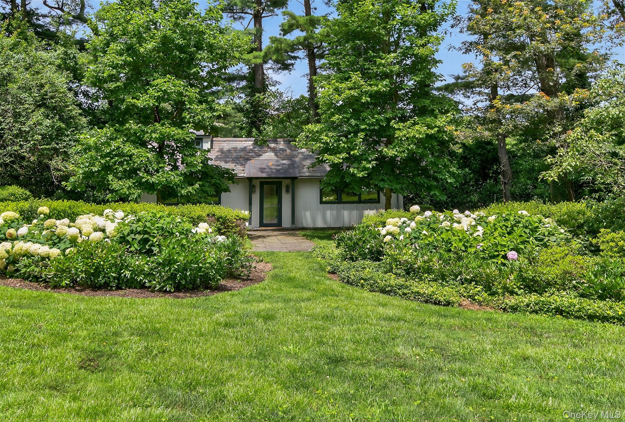 343 Chicken Valley Road Glen Head, NY 11545 - Photo 29 of 49 a view of a garden with a house
