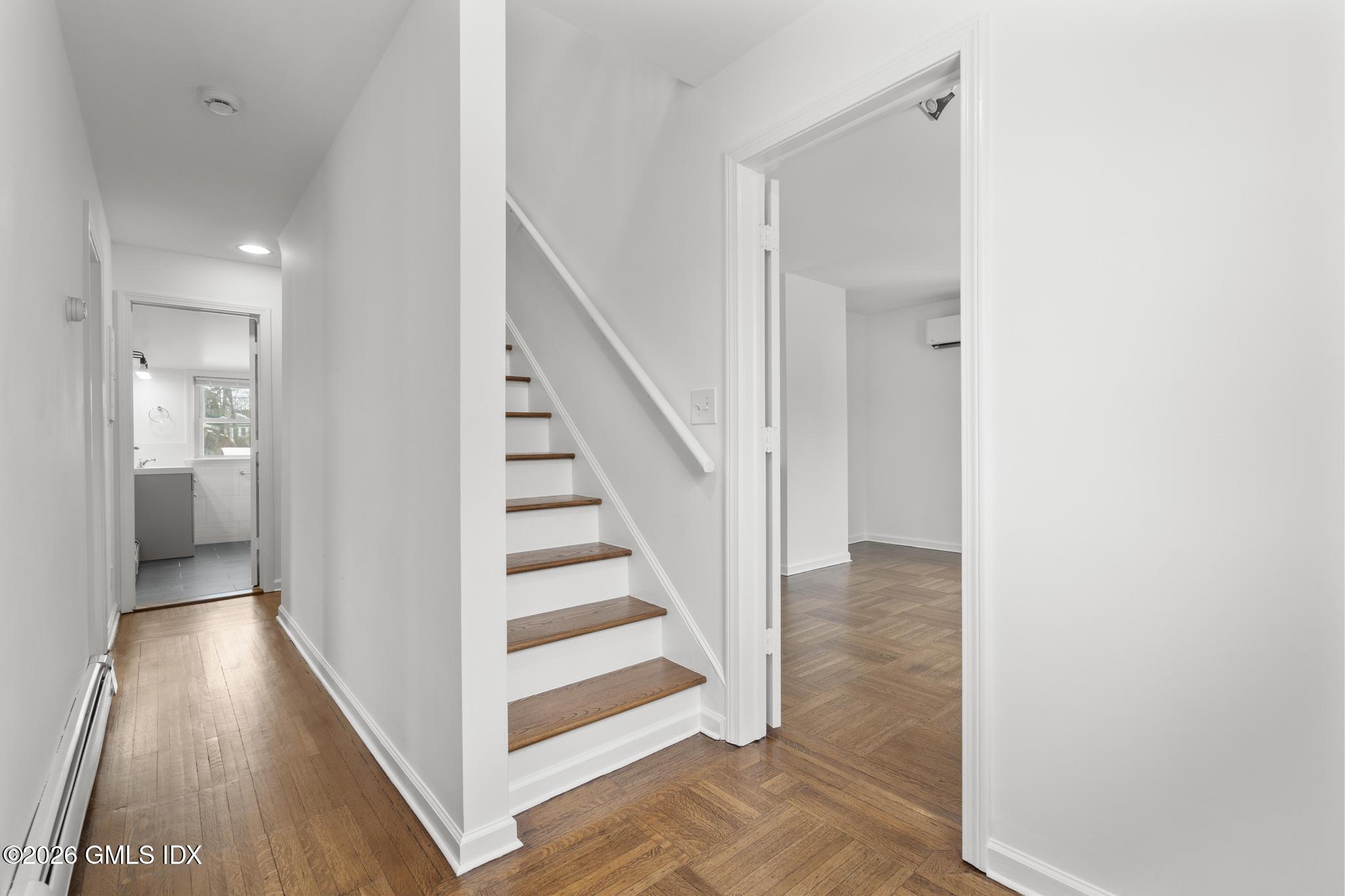 134 River Rd Extension, Unit 2 Cos Cob, CT 06807 - Photo 14 of 19 a view of a hallway with wooden floor and entryway