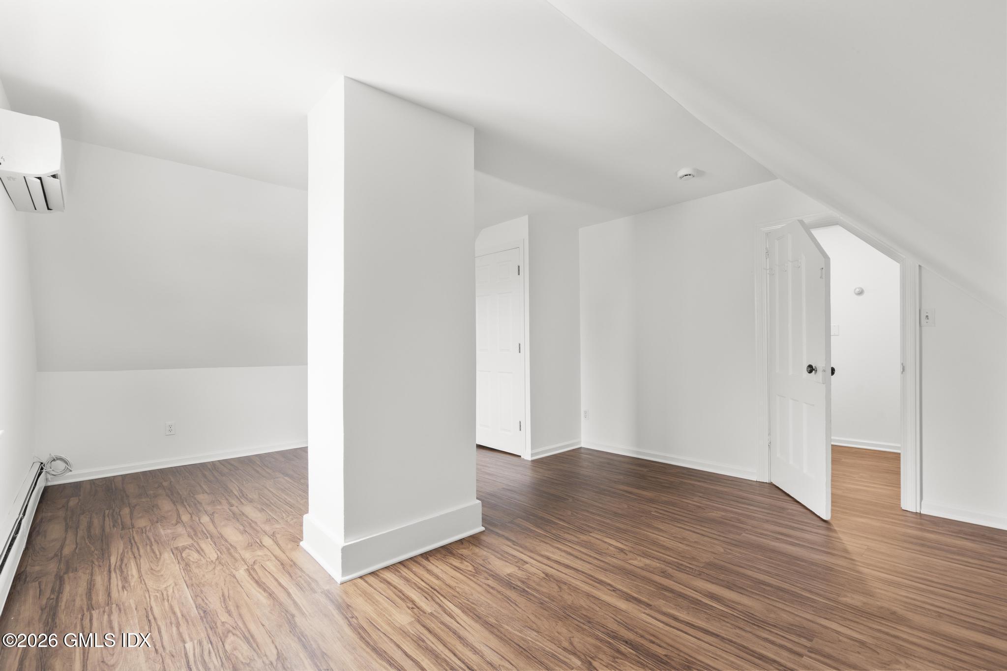 134 River Rd Extension, Unit 2 Cos Cob, CT 06807 - Photo 16 of 19 a view of a room with wooden floor
