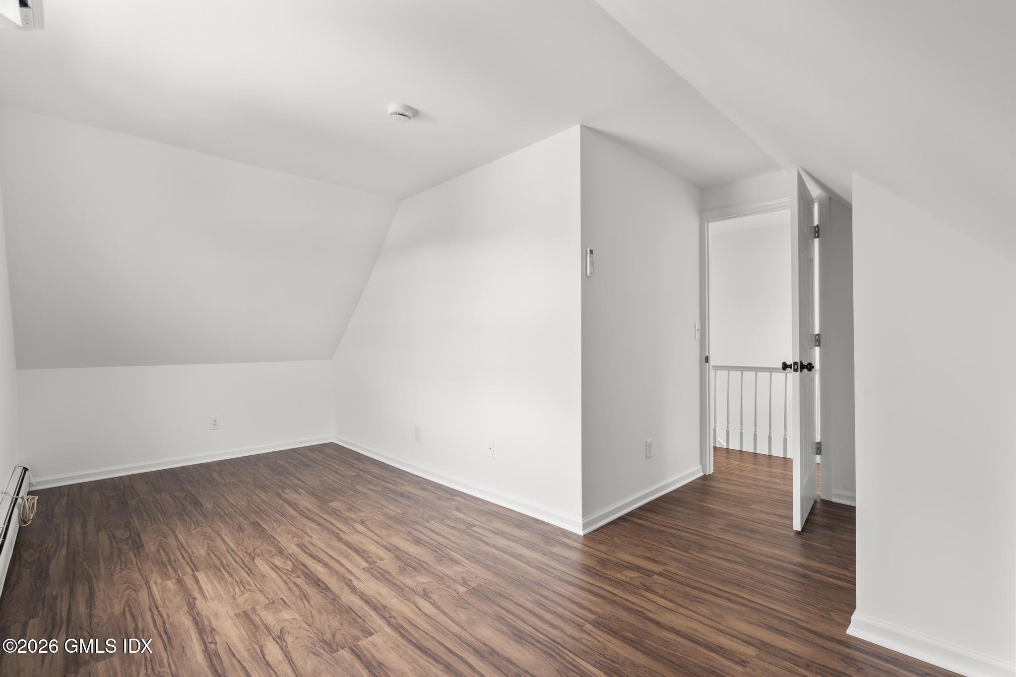 134 River Rd Extension, Unit 2 Cos Cob, CT 06807 - Photo 18 of 19 a view of a room with wooden floor
