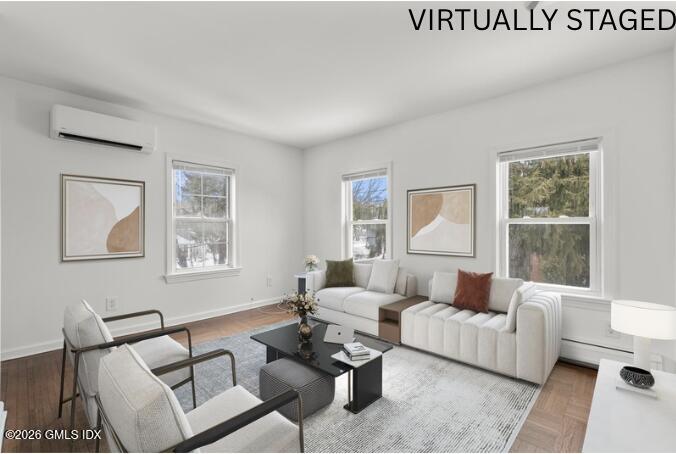 134 River Rd Extension, Unit 2 Cos Cob, CT 06807 - Photo 2 of 19 a living room with furniture and a window