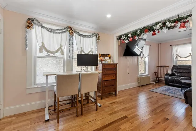 a view of kitchen with furniture and wooden floor
