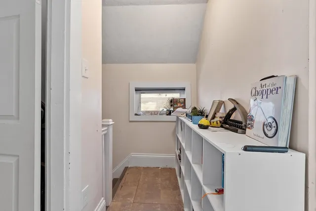 a picture of a bench in front of a wall