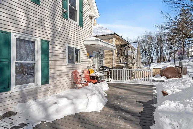 a kitchen with stainless steel appliances kitchen island granite countertop a stove a sink dishwasher a refrigerator and a oven with wooden floor