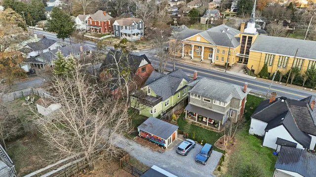 an aerial view of residential houses with outdoor space