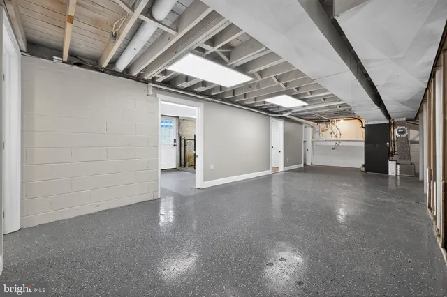 a view of empty room with wooden walls